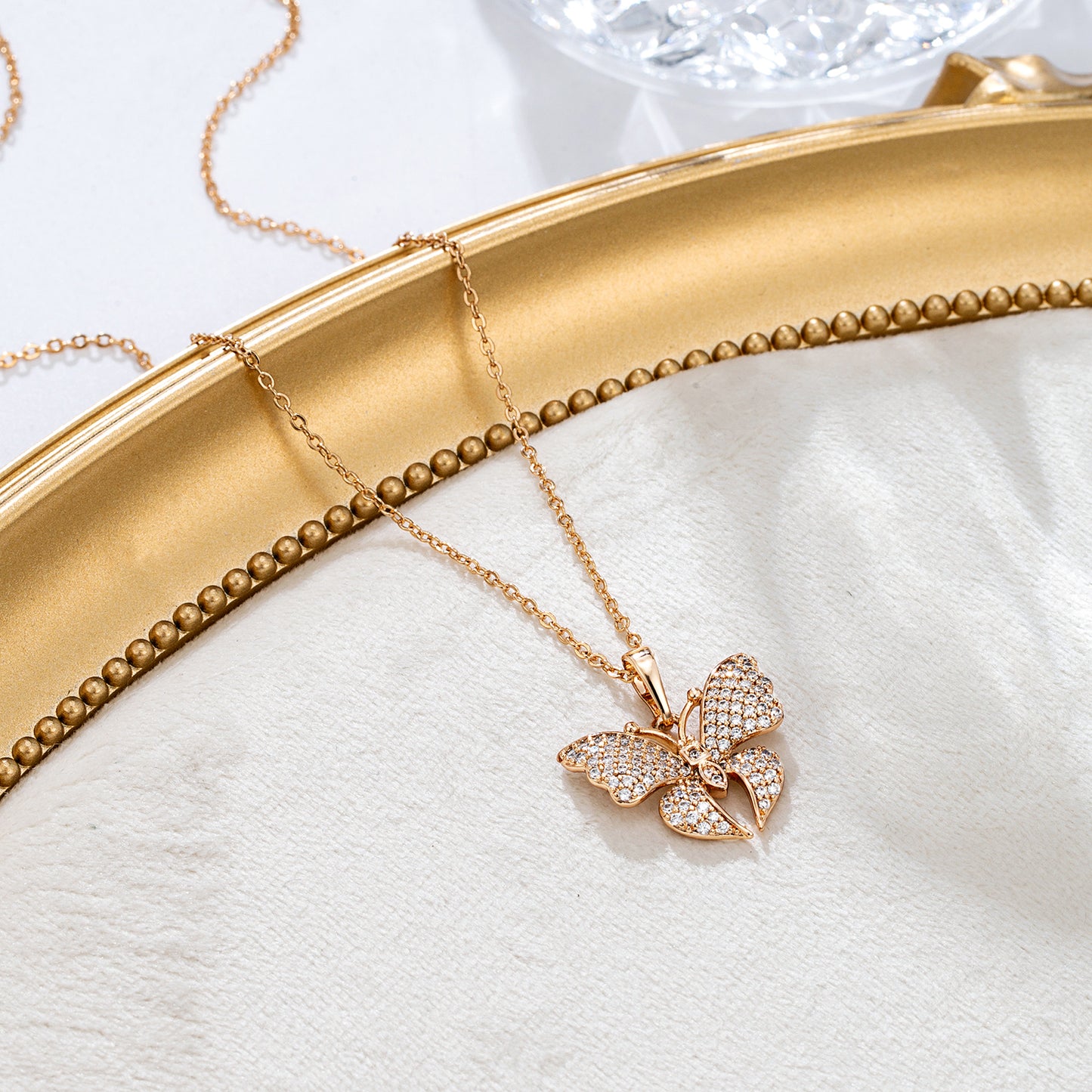 Collier papillon pavé strass doré