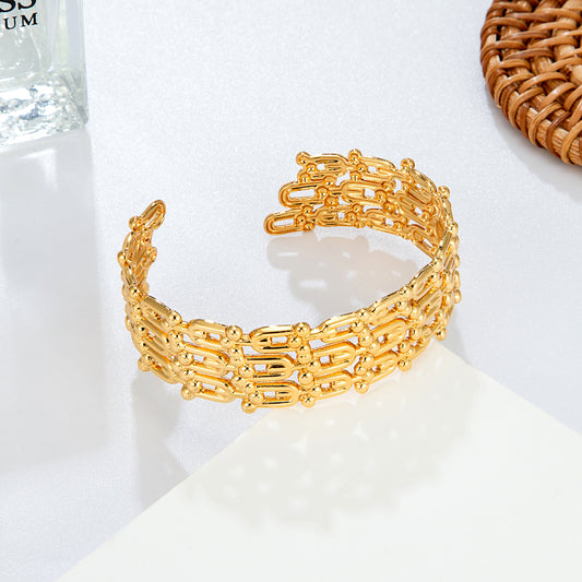Bracelet jonc chaînes dorées ouvert