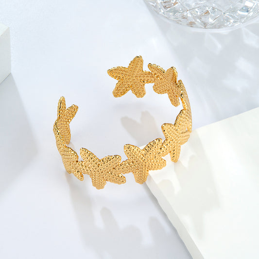Bracelet jonc fleurs dorées ouvert