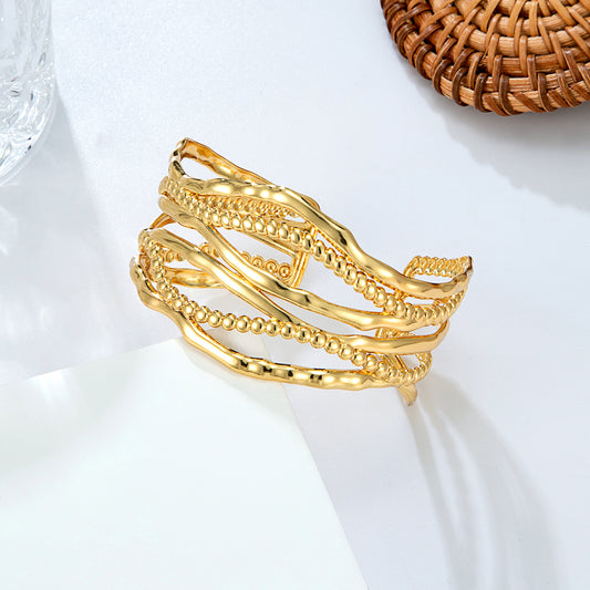 Bracelet jonc ondulé doré torsadé
