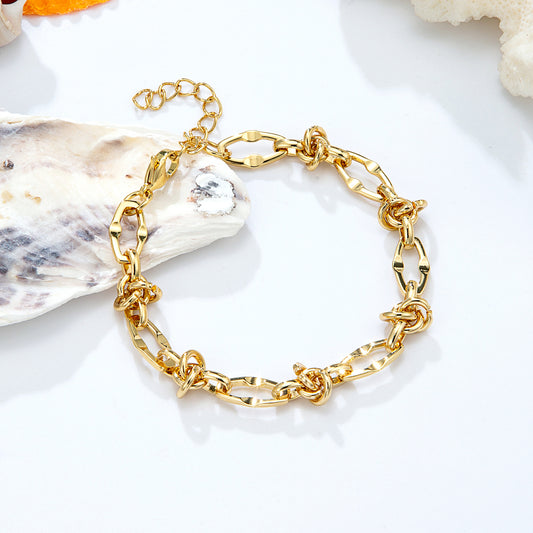 Bracelet chaîne dorée nœuds entrelacés