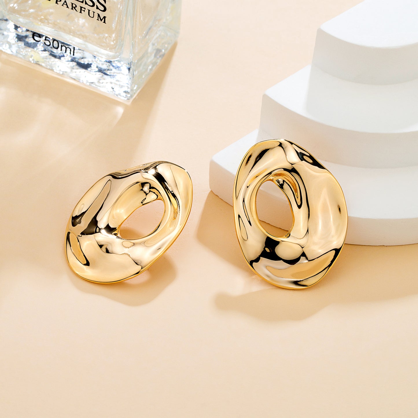 Boucles d’oreilles organiques dorées