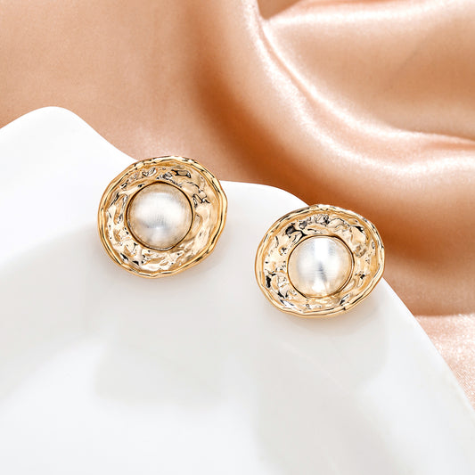 Boucles d’oreilles nid d'une perle blanche