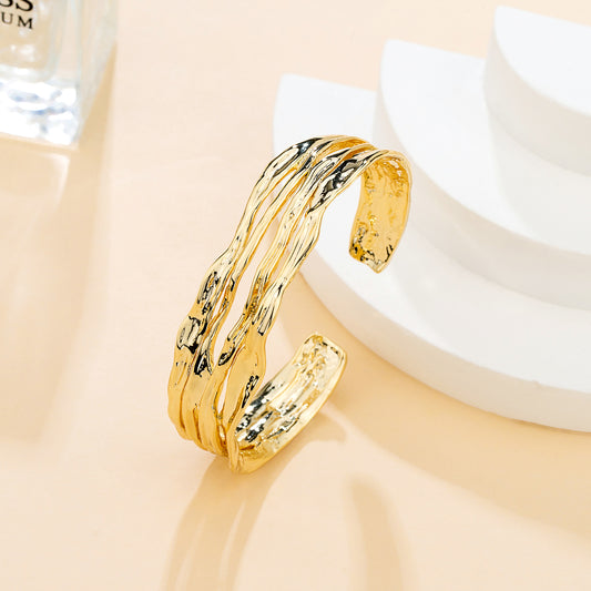 Bracelet ouvert ondulé – doré