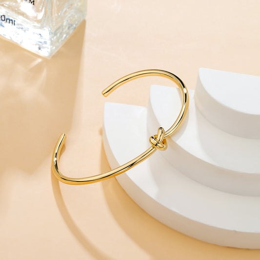 Bracelet fin nœud doré