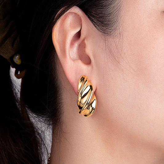 Boucles d'oreilles dorées spirales élégantes
