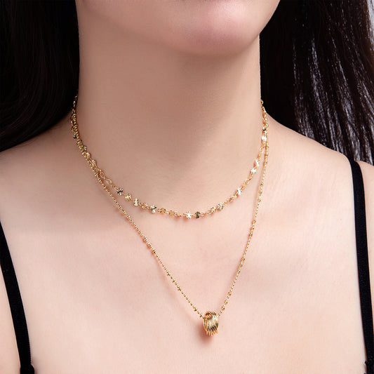 Collier double chaîne dorée avec pendentif nœud élégant