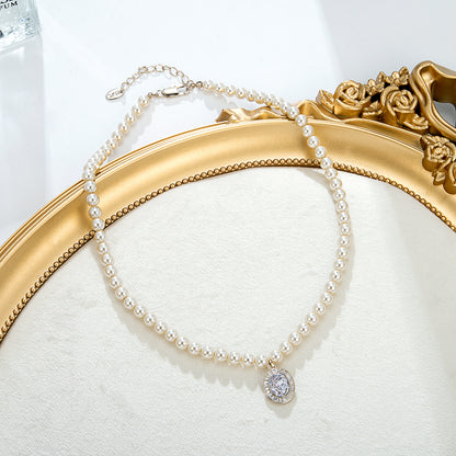 Collier perles dorées pendentif strass élégant