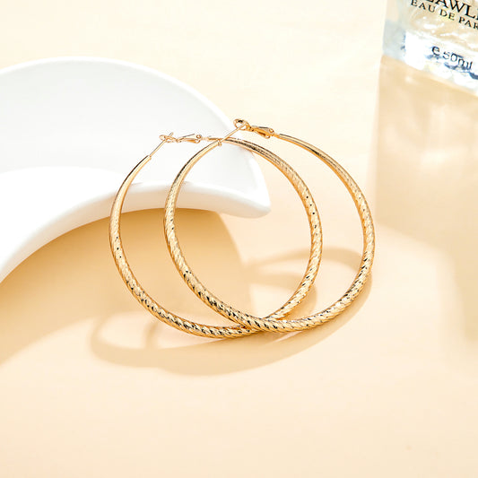 Créoles dorées – Relief diamanté brillant