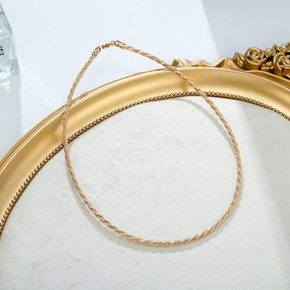 Collier chaîne torsadée dorée fine