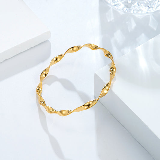 Bracelet jonc torsadé doré ondulé