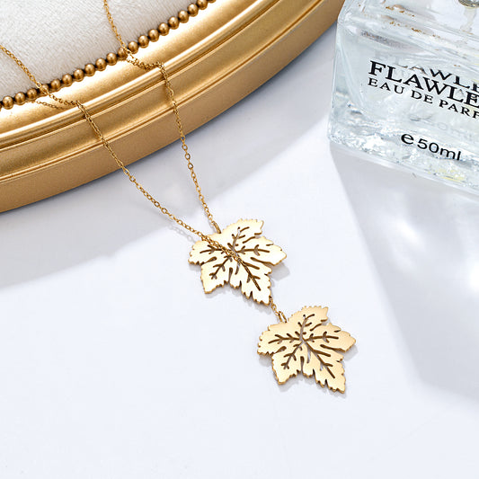 Collier pendentif double feuilles dorées